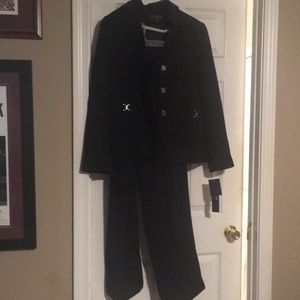 Black pants suit with gold buttons and accents.